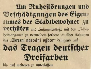 Vyhláška starosty města Olomouce Karla Brandhubera z 30. října 1918. Státní okresní archiv v Olomouci. Překlad německého textu vyhlášky: „Oznámení. Aby se zamezilo rušení klidu, škodám na majetku obyvatel města a srážkám s bezpečnostními orgány, nařizuji na základě žádosti Okresního národního výboru zanechat až na další nošení německé trikolóry. Z obecní rady královského hlavního města Olomouce 30. října 1918. Starosta: Brandhuber.“